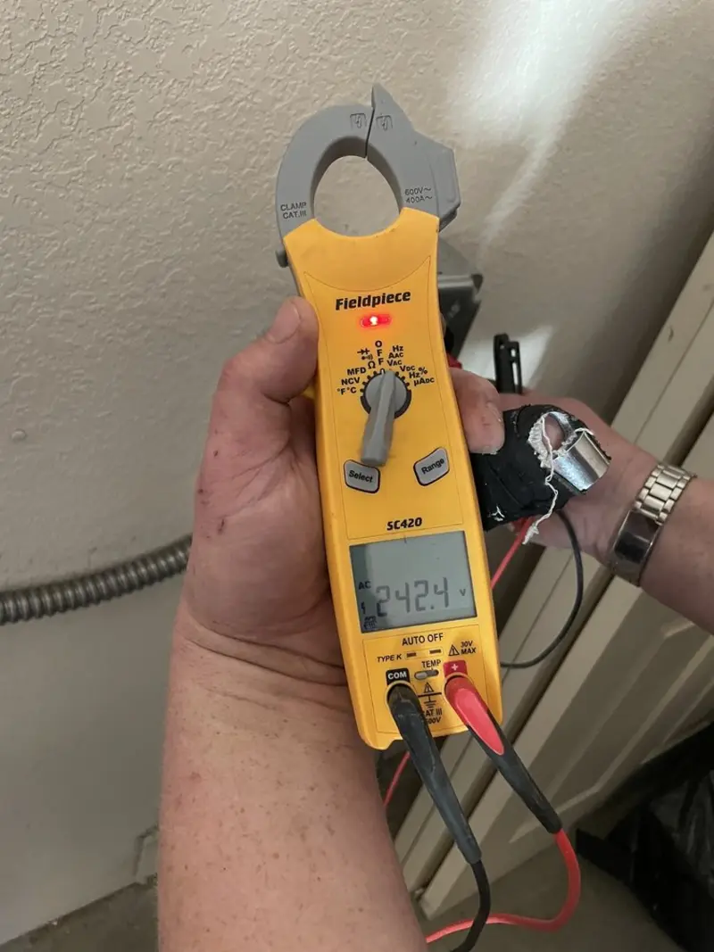 Voltage testing with clamp meter during Whole House Surge Protector in Boyertown